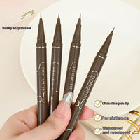 Four brown eyeliner pens held by a hand with a beige background